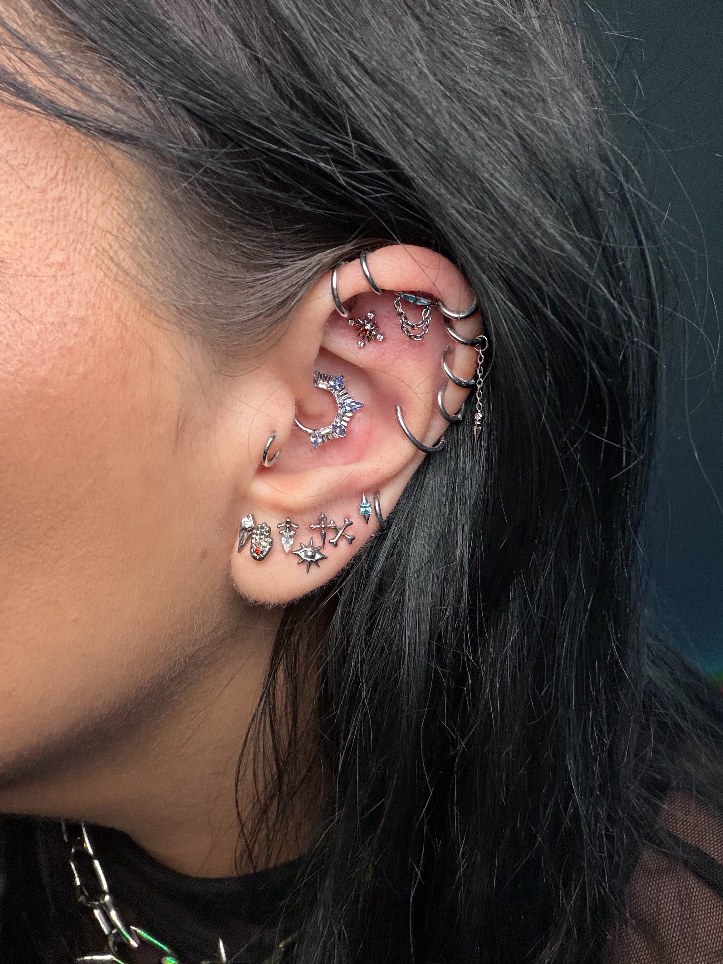 christystarmua ear stack featuring silver and crystal jewelry