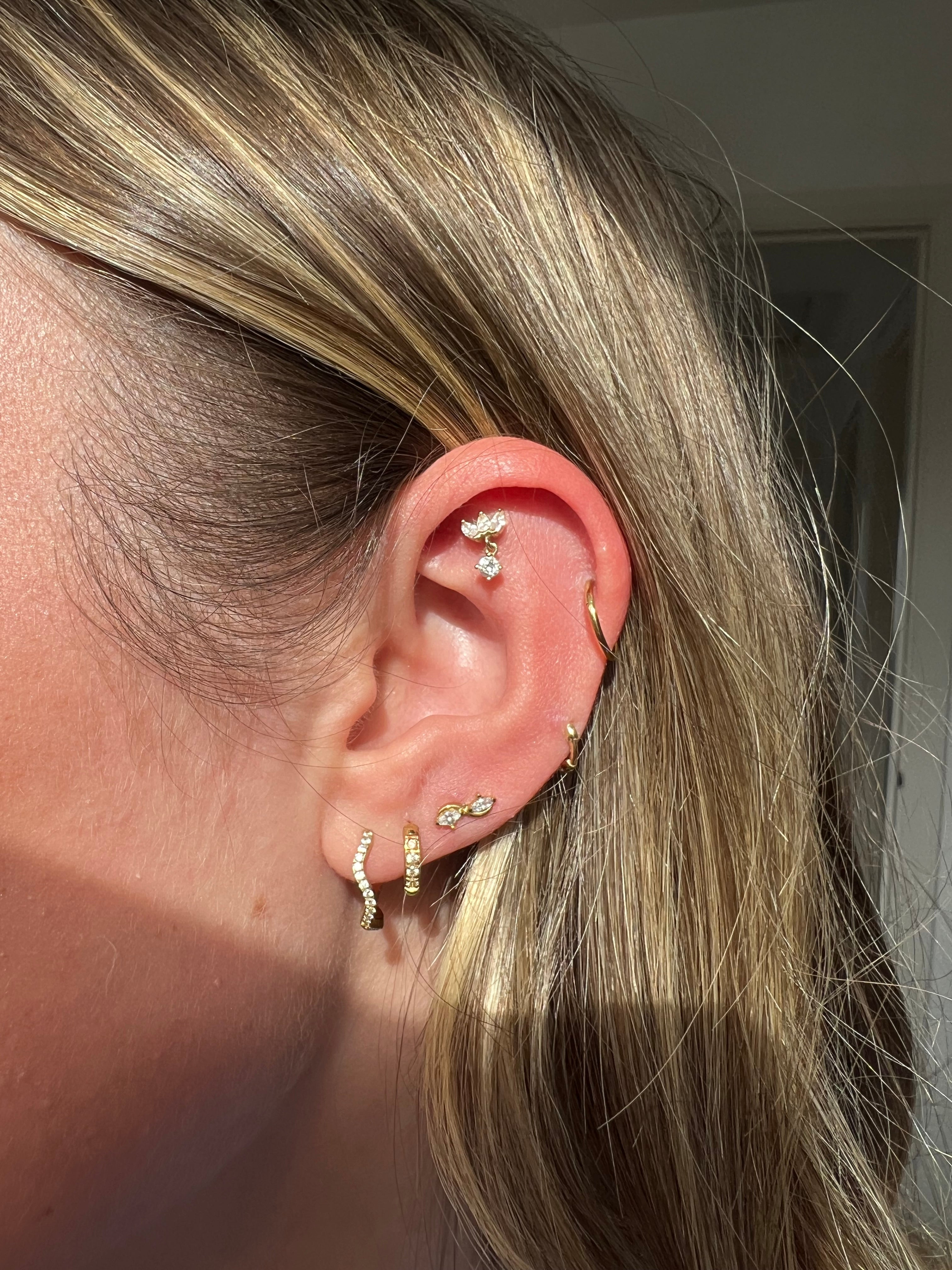 Holly Ash ear stack featuring gold and crystal jewelry