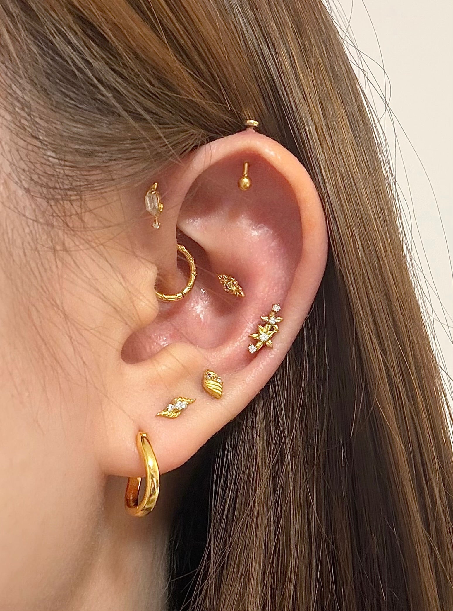 ingrid ear stack featuring gold and crystal jewelry