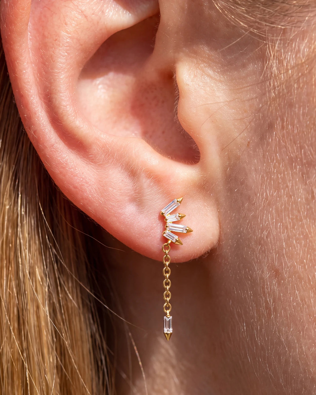 Prism Drift Flatback Stud, gold with clear cubic zirconia, on-ear styling