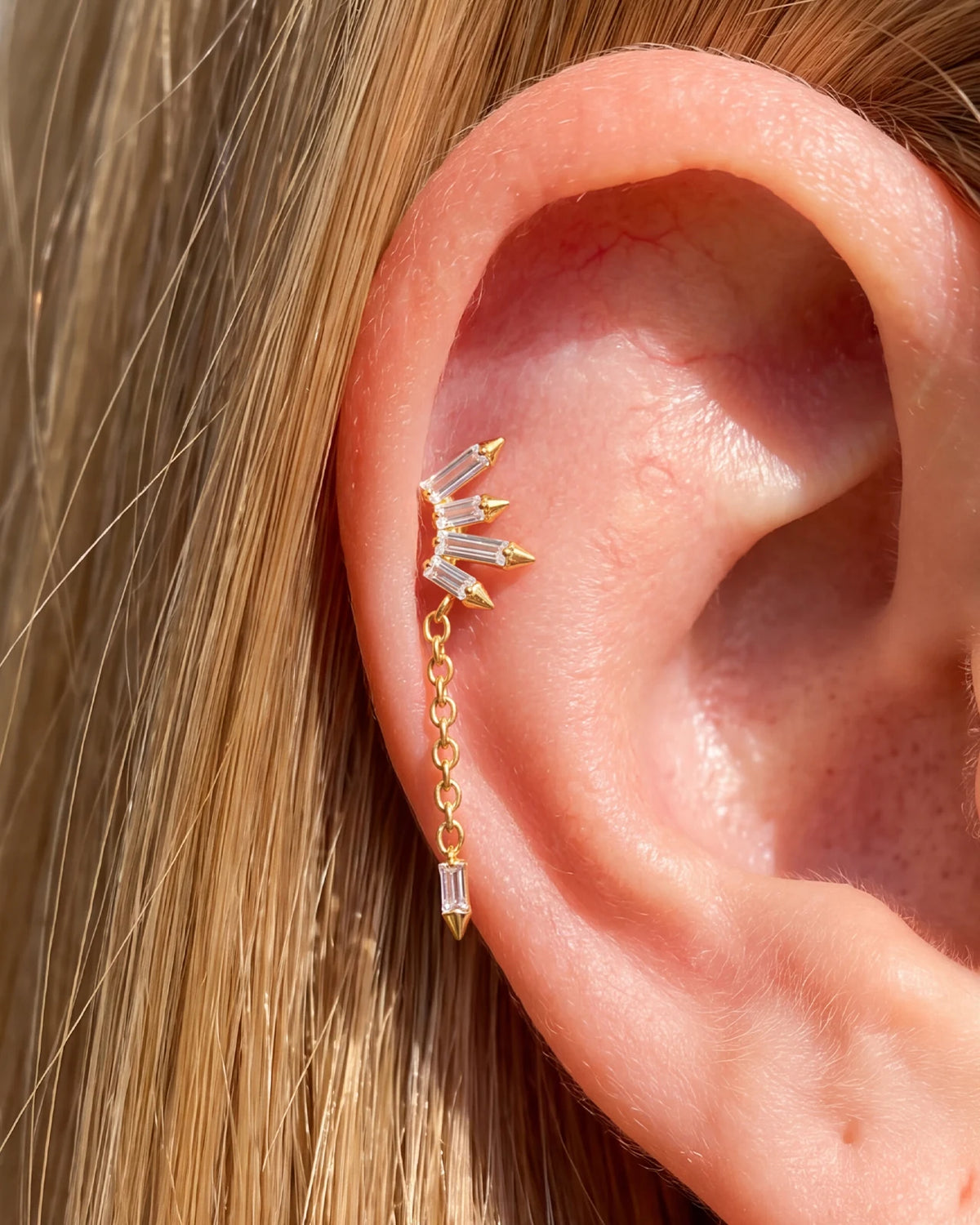 Prism Drift Flatback Stud, gold with clear cubic zirconia, on-ear styling