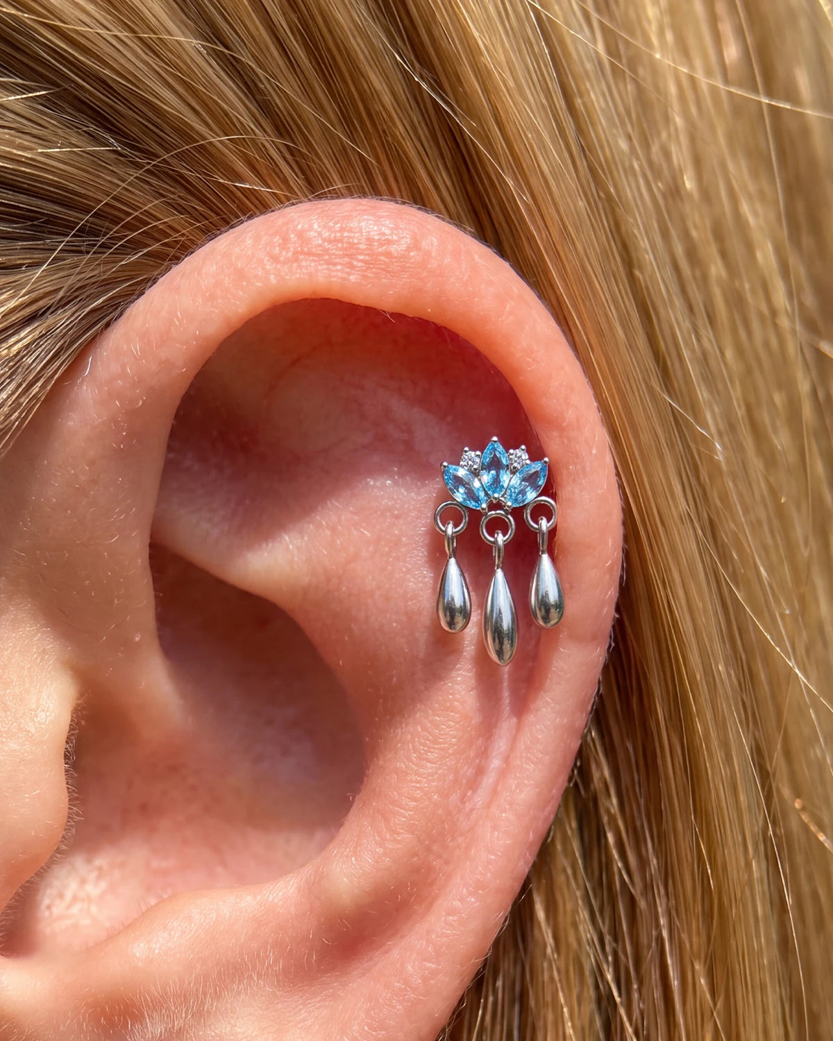 Petal Rain silver ocean blue flatback stud styled on the helix
