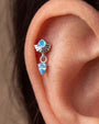 Deco Dew Flatback Stud, silver with blue cubic zirconia, on-ear styling