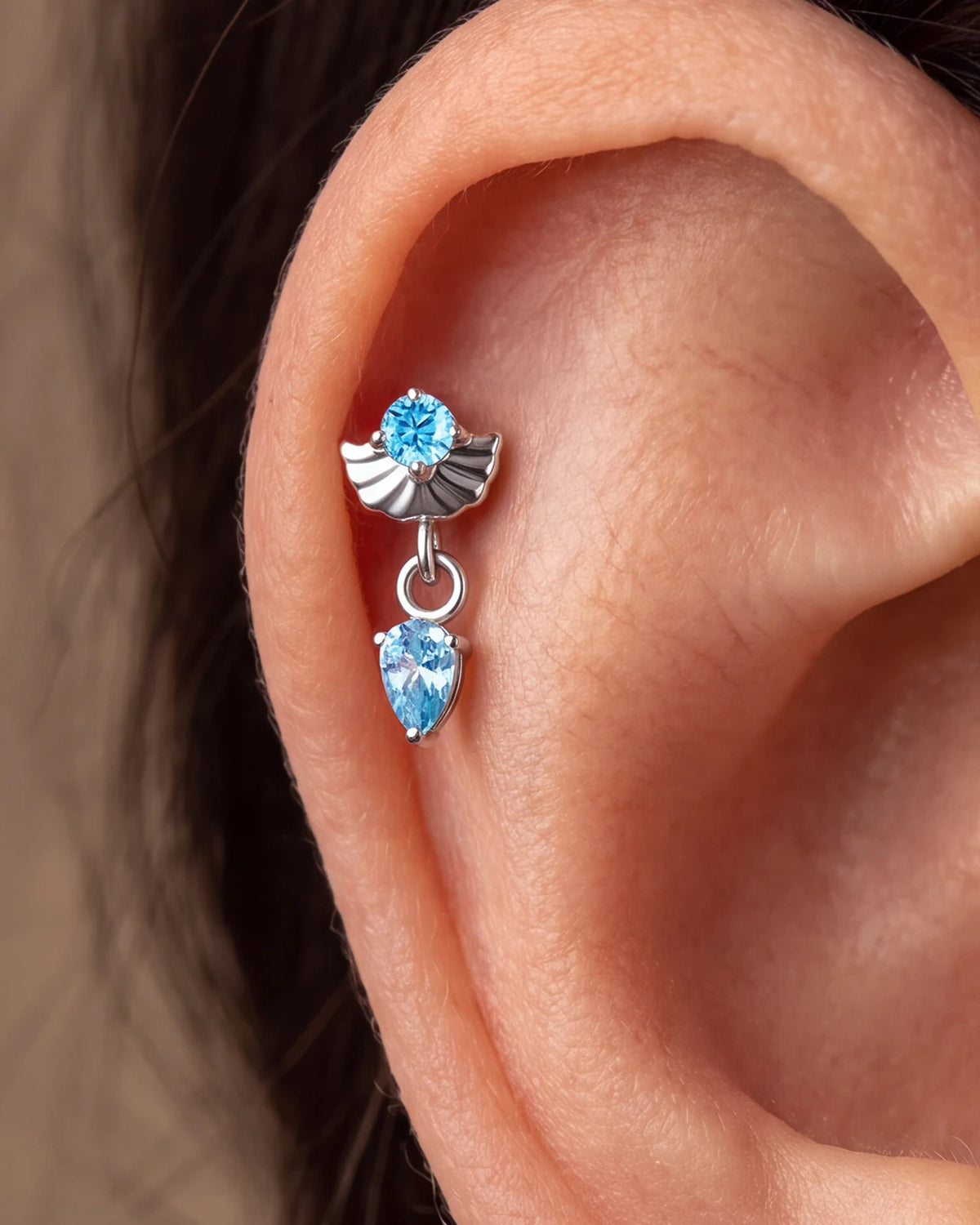 Deco Dew Flatback Stud, silver with blue cubic zirconia, on-ear styling