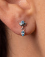 Deco Dew Flatback Stud, silver with blue cubic zirconia, on-ear styling
