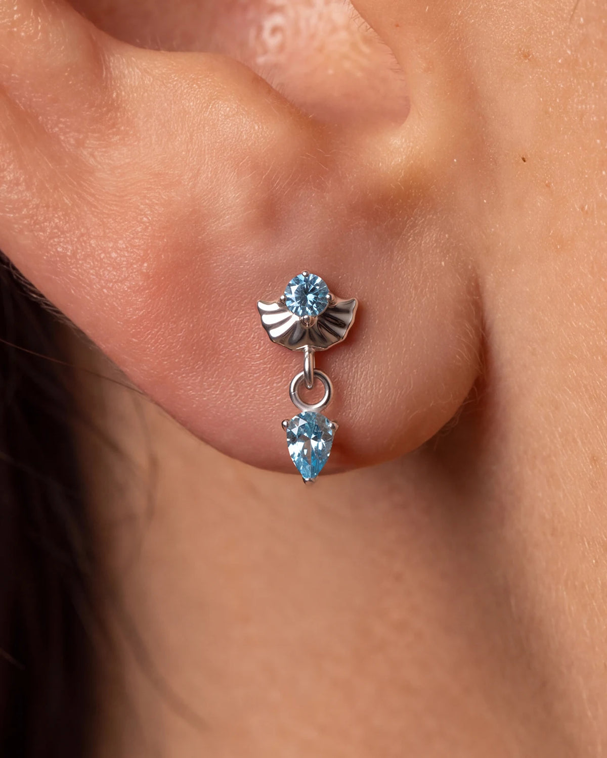 Deco Dew Flatback Stud, silver with blue cubic zirconia, on-ear styling