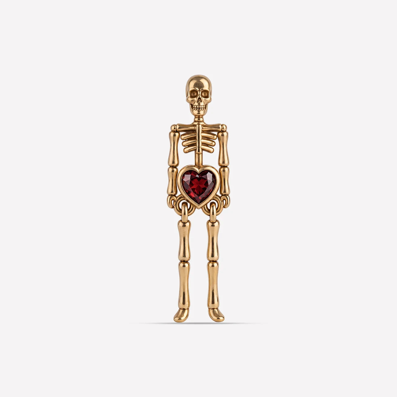 Undead Love skeleton flatback stud, gold with red heart zirconia, front view