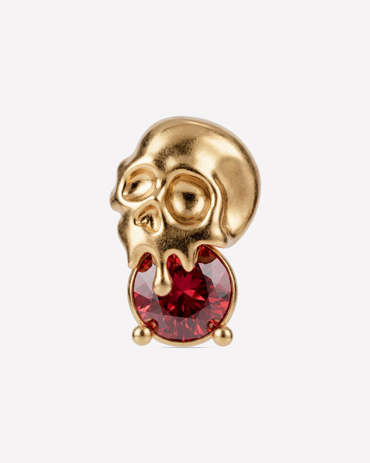Skull Melt Flatback Stud in gold tone with garnet red cubic zirconia - front view