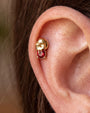 Skull Melt Flatback Stud in gold tone with garnet red cubic zirconia - helix styling