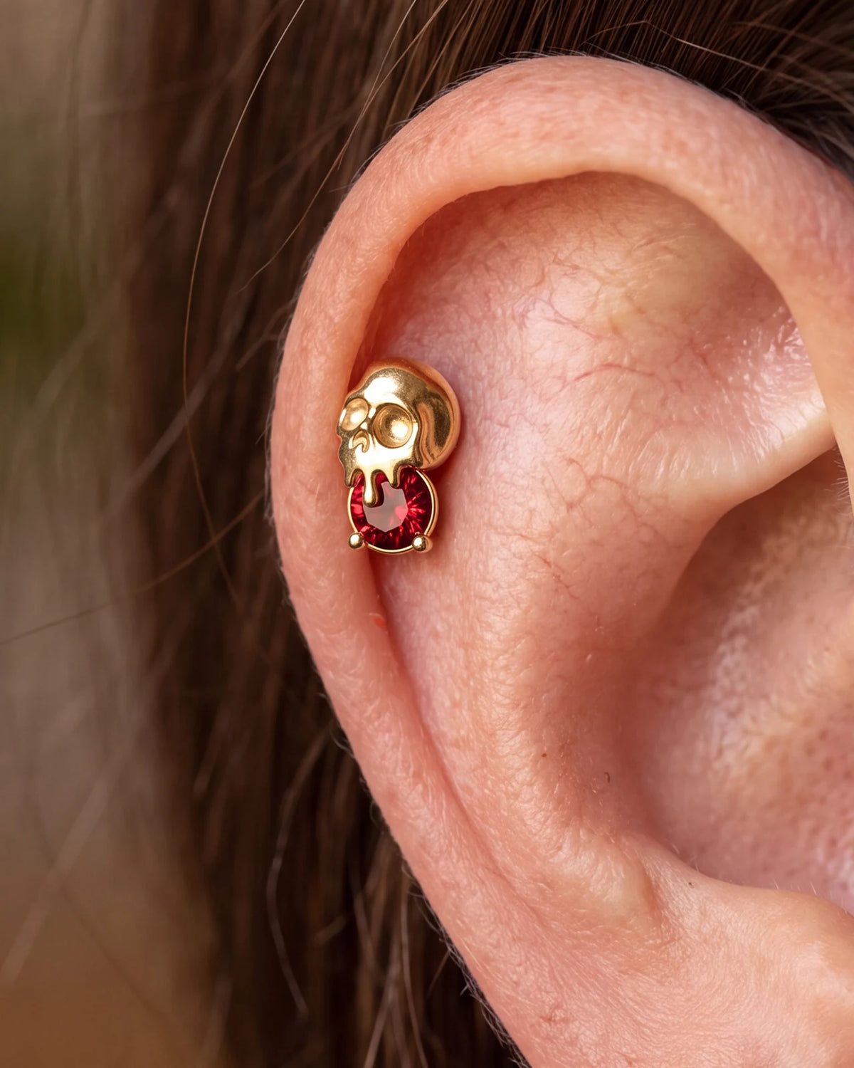 Skull Melt Flatback Stud in gold tone with garnet red cubic zirconia - helix styling