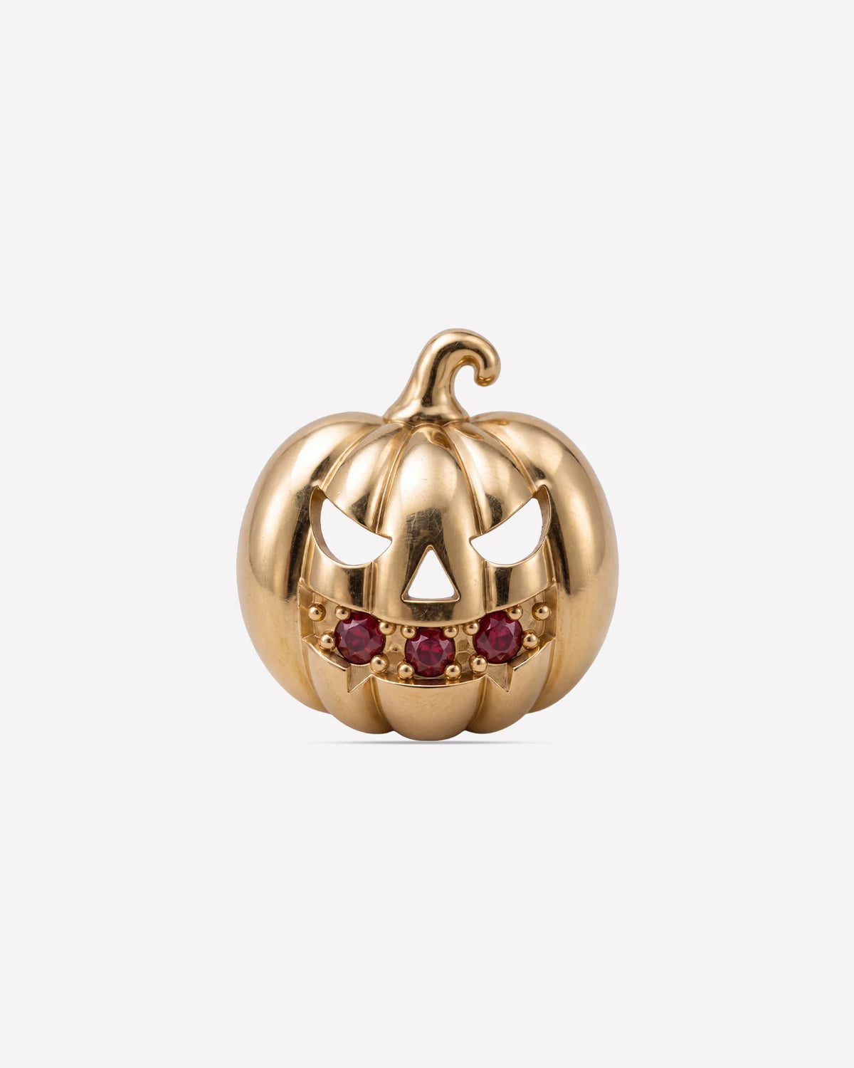 Wicked Grin pumpkin flatback stud, gold with red cubic zirconia, front view