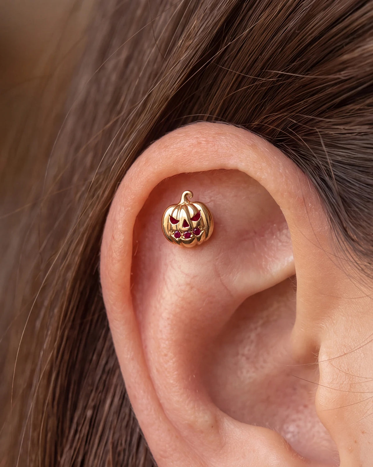 Wicked Grin pumpkin flatback stud, gold with red cubic zirconia, flat piercing styling
