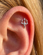 Silver trident flatback stud styled in a curated ear