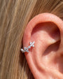 Silver Lucky Bloom Huggie Clicker worn on lobe