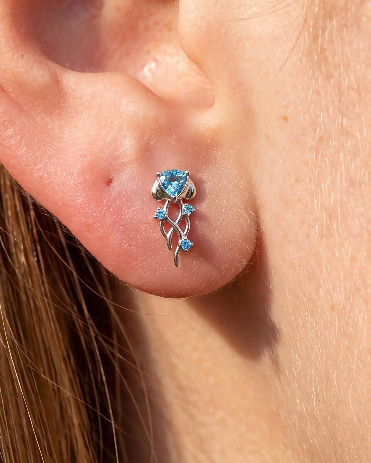 Moonlit Jellyfish silver ocean mist flatback stud worn on lobe