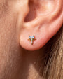 Radiant Wingcrest Flatback Stud, gold tone with light blue center stone, ear styling detail