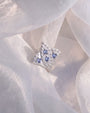 Royal Fleur Flatback Stud, silver tone with blue violet stones, styled product view