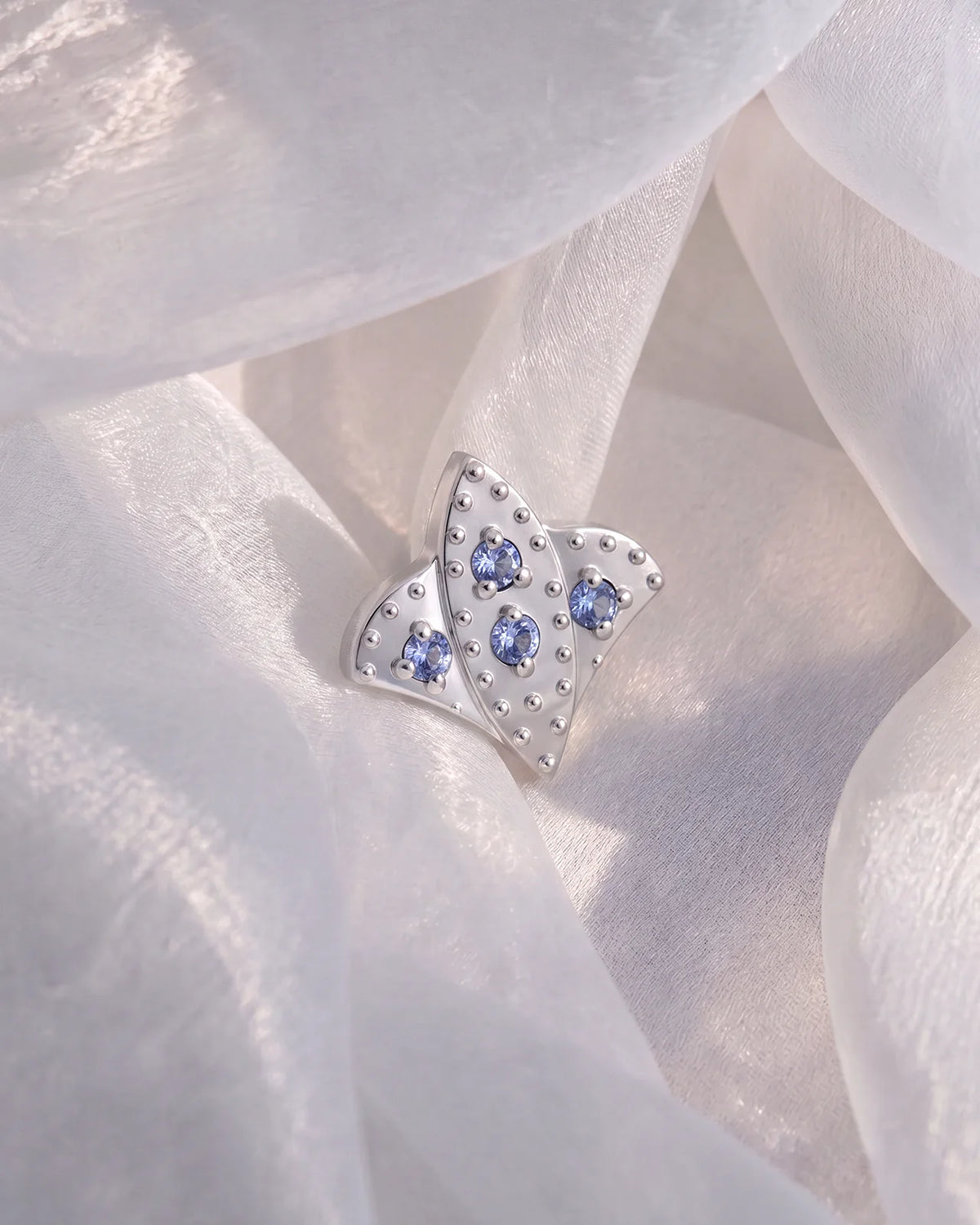 Royal Fleur Flatback Stud, silver tone with blue violet stones, styled product view