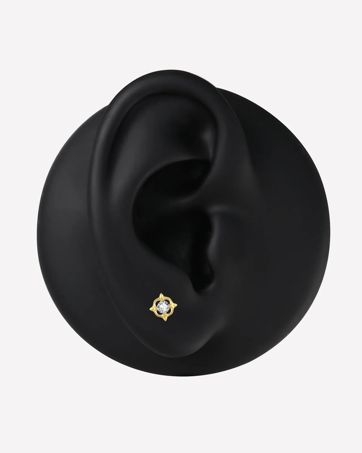 Star Halo Flatback Stud in gold tone, ear display