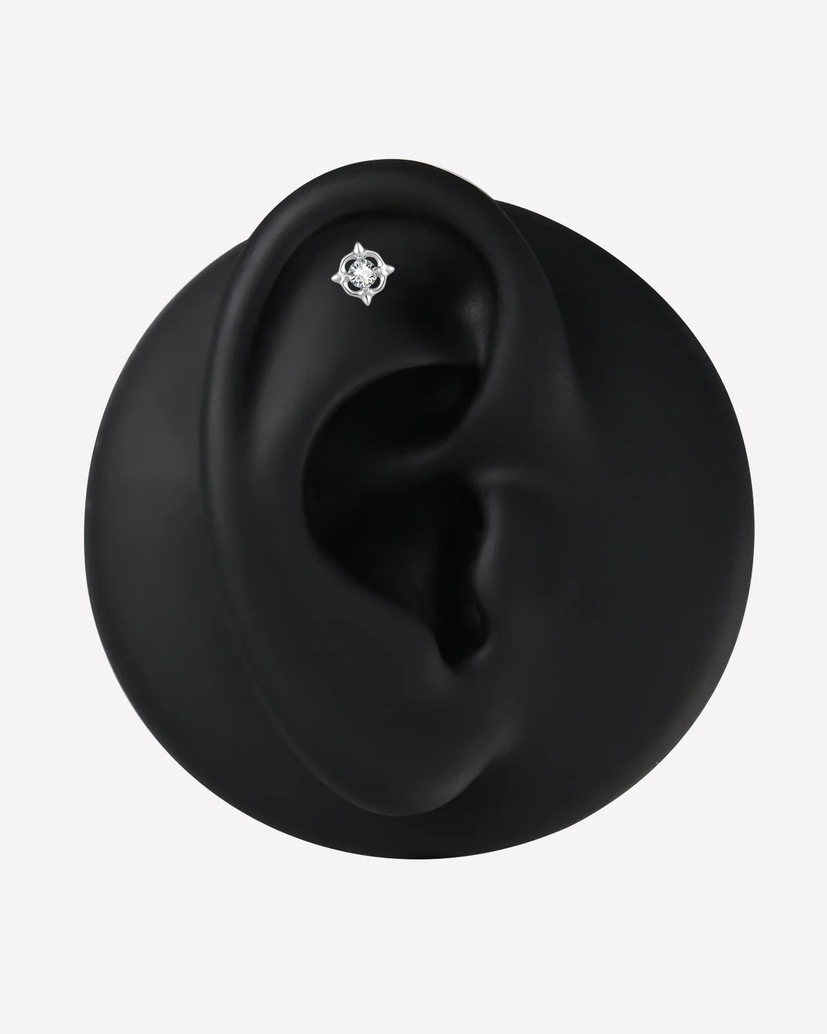 Star Halo Flatback Stud in silver tone, ear display