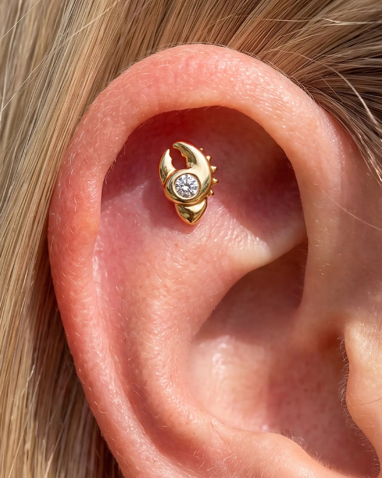Tidal Claw gold crystal clear flatback stud worn in helix piercing