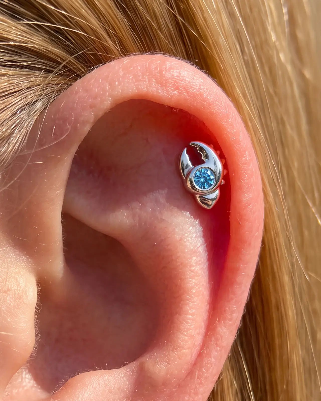 Tidal Claw silver ocean mist flatback stud worn in helix piercing